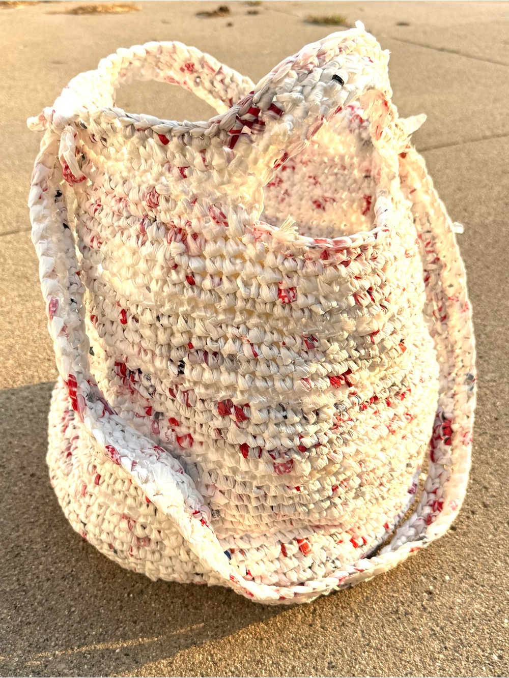 Handmade from plastic bags crocheted shopping tote bag with a pocket